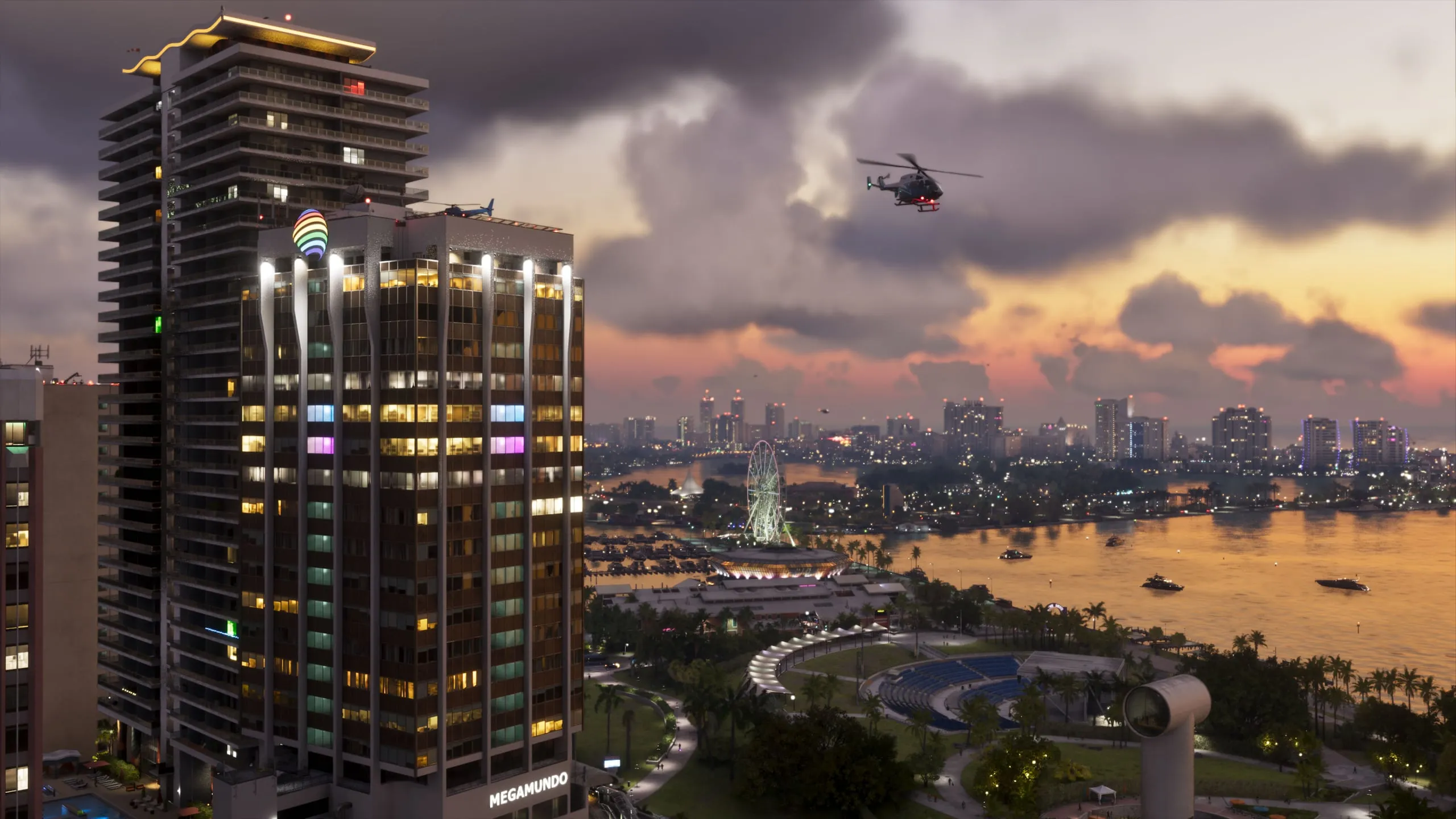 Ein Büroturm in Vice City bei Sonnenuntergang, mit einem Hubschrauber darüber, auf einem offiziellen Screenshot von GTA VI.