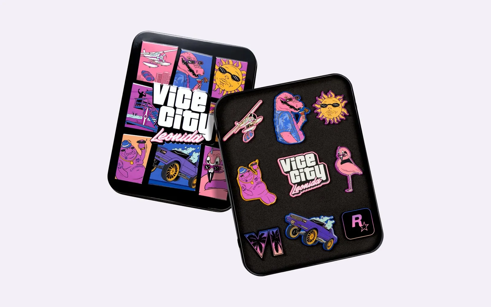 Zwei schwarze Dosen, eine mit dem Vice-City-Artwork auf dem Deckel und eine offen mit emaillierten Pins der Figuren und eines Autos.